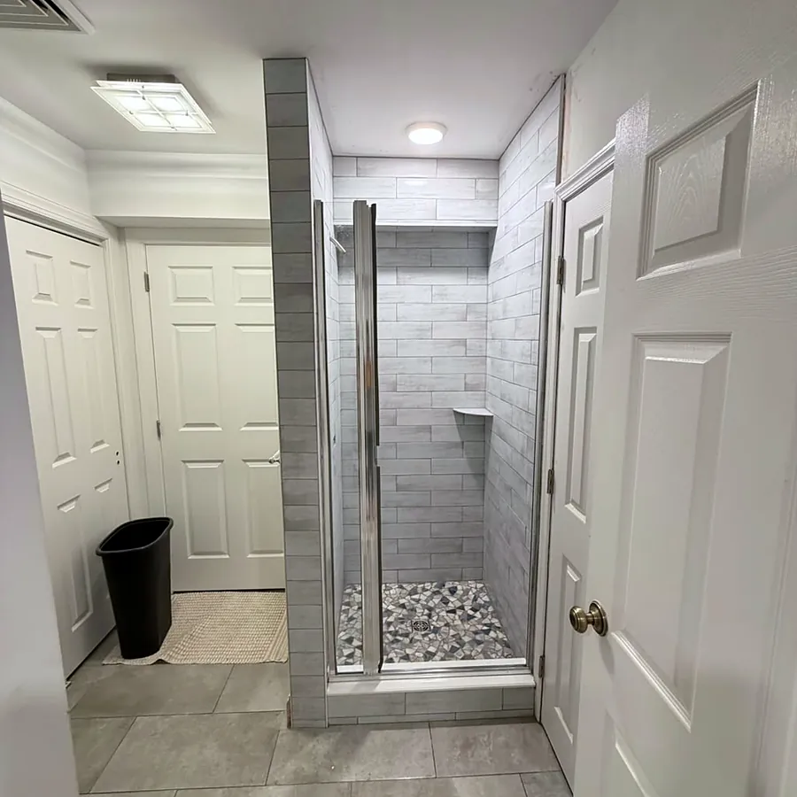 Frameless glass, pebble shower pan